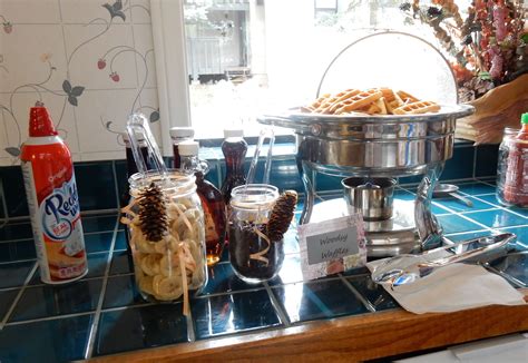 Waffle Bar With Toppings In Mason Jars With Pine Conespeach Ribbons
