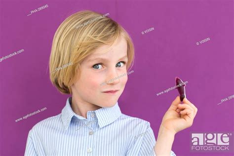 7 Year Old Boy Eating Sugary Sweet Stock Photo Picture And Rights