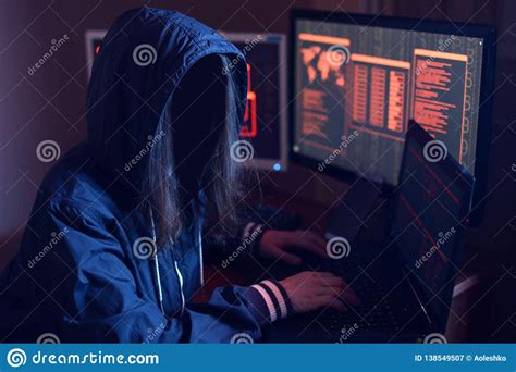 Anonymous Hacker Girl With No Face Typing The Code Tries To Hack The