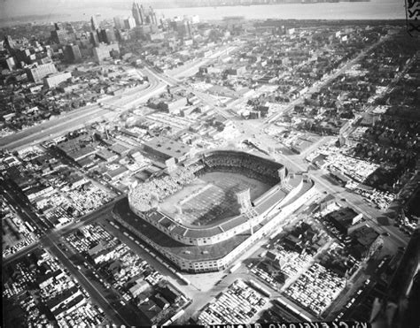 An Aerial View Of A Baseball Stadium In The Middle Of A City With Tall