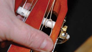 Firstly, we need to get the old strings off. Guitar setup: how to restring a nylon-string classical ...