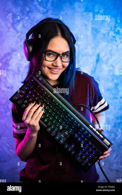 Beautiful Professional Gamer Girl With Keyboard Casual Cute Geek Wearing Glasses And Smiling