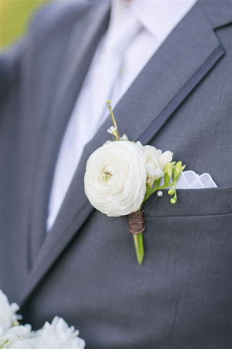 White Ranunculus And Freesia Boutonniere