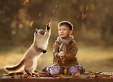 20 Adorable And Funny Photos Of Kids With Animals