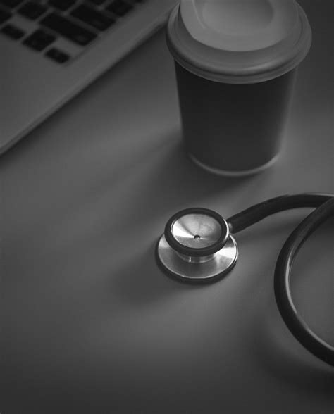 download free image of closeup of doctor stethoscope with coffee paper cup by jira about coffee