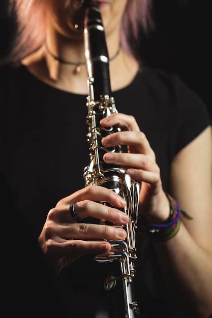 Woman Playing A Clarinet In Music School Photo Free Download