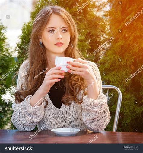 Beautiful Young Woman Drinking Hot Coffee Stock Photo 377127169