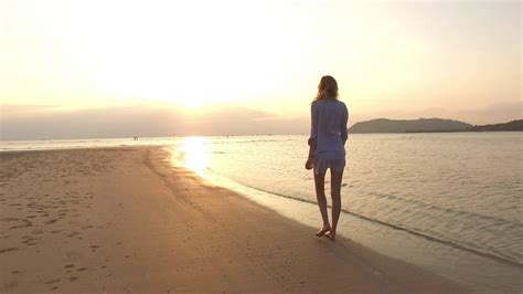 Girl Walking On The Beach At Sunset Stock Video Footage 0018 Sbv