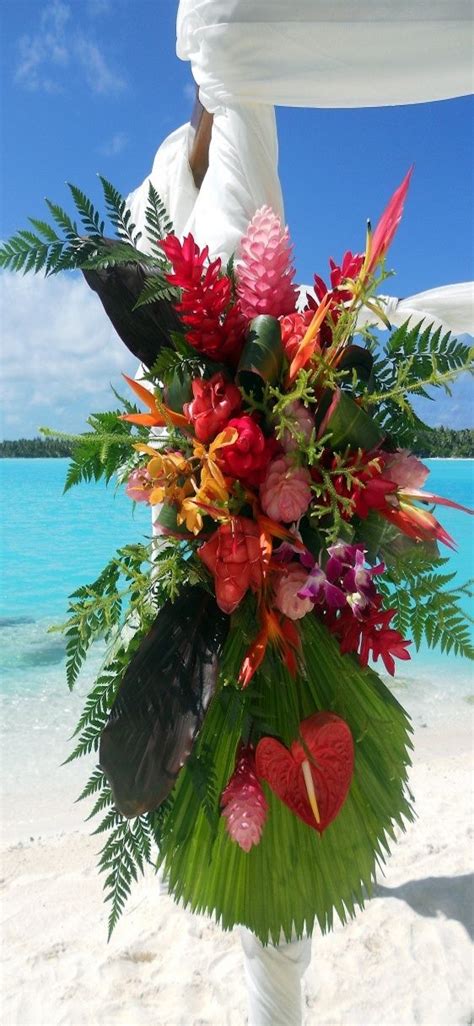 Tropical flowers conjure up images of romance, of idyllic islands, balmy evenings and relaxing holidays, making them natural choices for wedding for tropical flowers with a sculptural quality, nothing beats heliconia. The St. Regis Bora Bora Resort - Wedding Arch detail ...