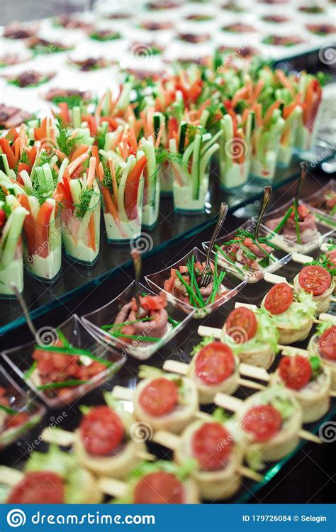 Cold weather outings are more fun when. Catering Banquet Table With Salads And Cold Snacks Stock ...