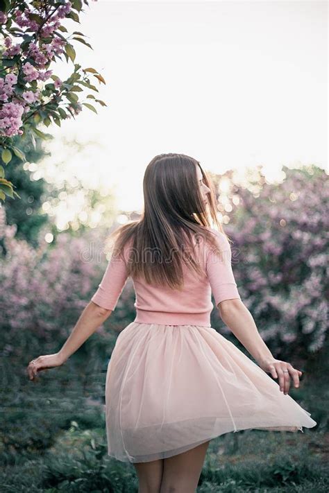 Girl In A Pink Dress Near The Cherry Blossom Stock Image Image Of