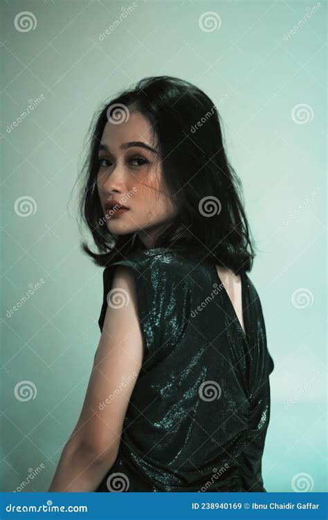 Indonesian Model Look At The Camera While Wearing A Black Dress For A