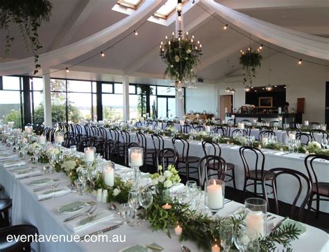Beautiful Foliage Chandelier And Bentwood Chairs With Long Greenery And