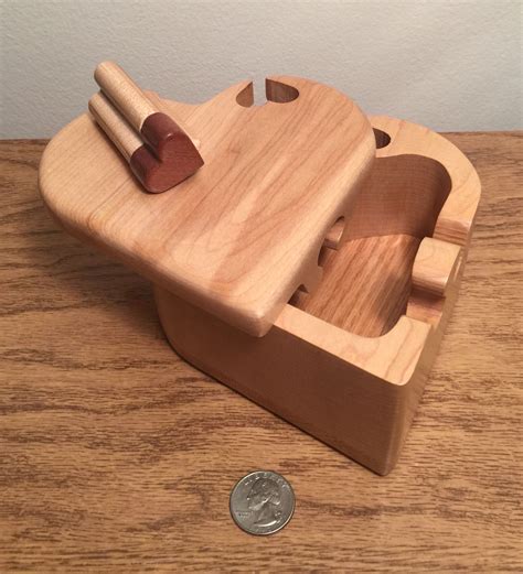 Great for learning how to grab and match objects. Bandsaw puzzle box made from a solid block of maple with ...