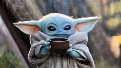 Baby Yoda Holding Mandalorian Helmet Helmet