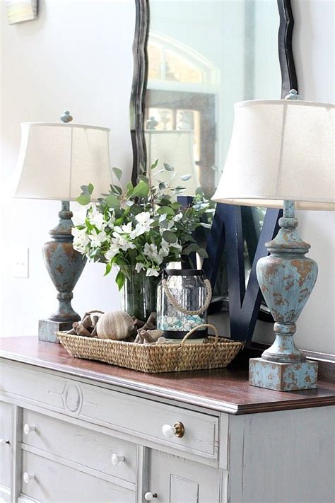 Any coffee table decor with a tray will look more organized, such as this acrylic tray that the joyful home uses. Decorating With Trays | Refresh Restyle