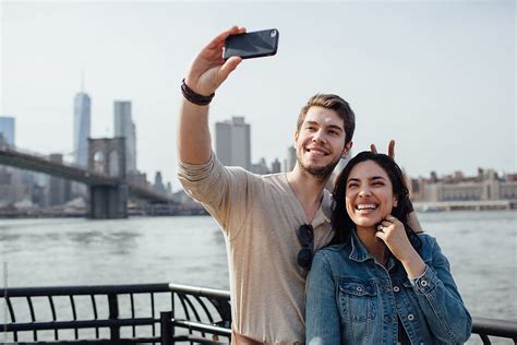 Happy Couple Taking A Selfie In Brooklyn By Stocksy Contributor