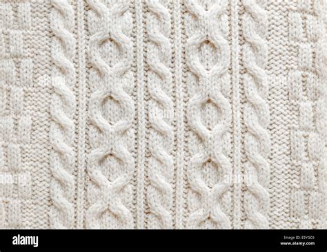 Knit Texture Of Light Natural Wool Knitted Fabric With Cable Pattern As