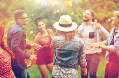 Happy Friends Dancing At Summer Party In Garden Stock Photo Image Of