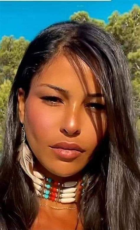 A Woman With Long Hair Wearing Native Jewelry