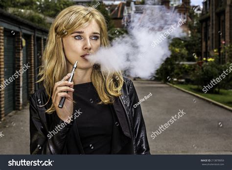 Pretty Blond Woman Smoking Ecigarette Standing Stock Photo 