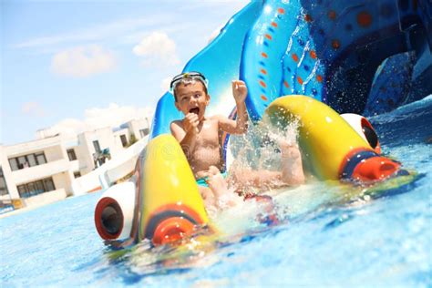 Boy On Slide At Water Park Summer Vacation Stock Photo Image Of