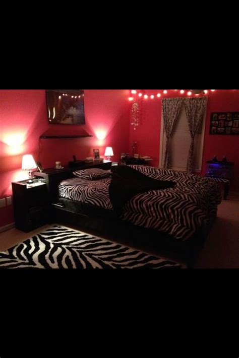 darker pink walls with black and white zebra print accents rug bedding curtains zebra