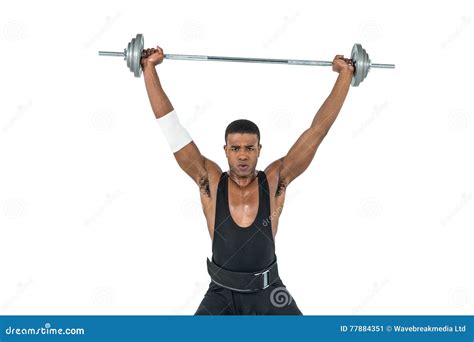 Portrait Of Bodybuilder Lifting Heavy Barbell Weights Stock Image