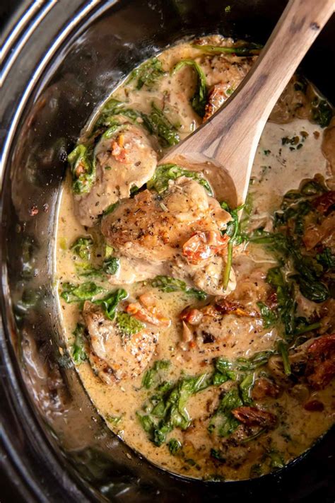 Creamy Tuscan Slow Cooker Chicken Thighs Are An Easy Comforting D