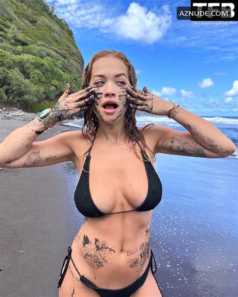 rita ora sexy poses showing off her boobs in a bikini on the beach in a social media photoshoot