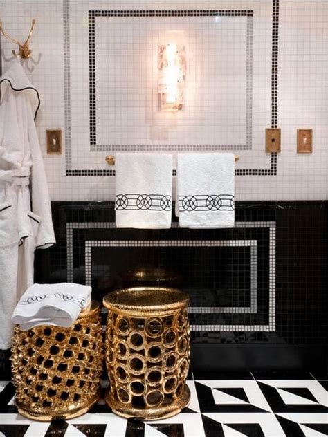 A modern white bathroom with gold framing up the shower, gold fixtures and handles and all white everything. All That Glitters is Gold - 10 Drop-Dead Gold Bathrooms - BetterDecoratingBibleBetterDecoratingBible