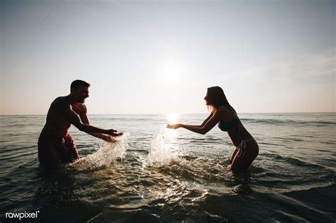 Couple Playing In The Water Premium Image By Mckinsey
