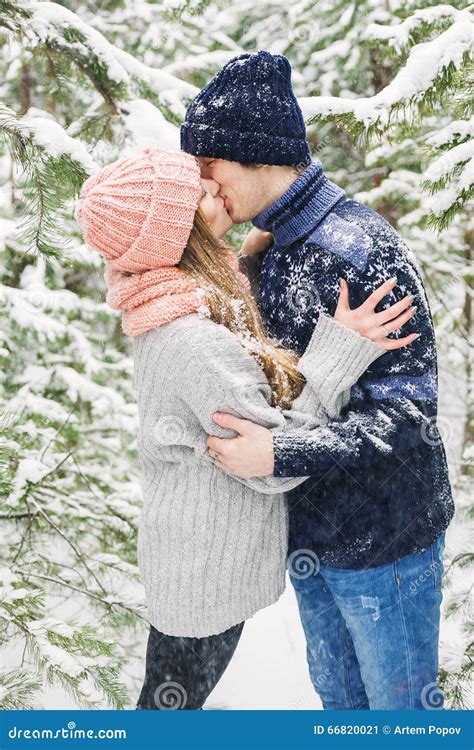 Happy Couple Kissing In Winter Forest And Snowfall Stock Image Image Of Christmas Romantic