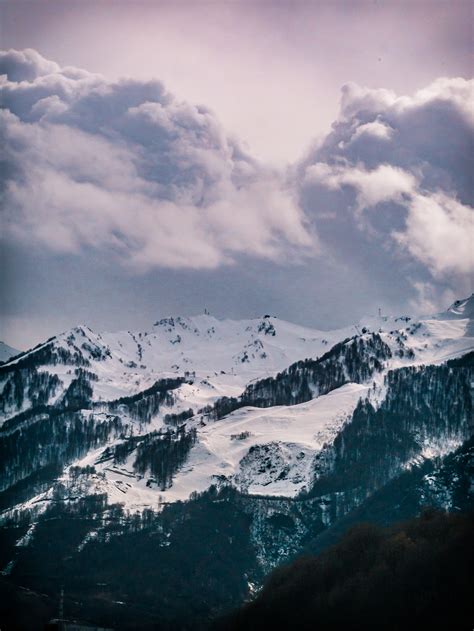 Photography Of Snow Capped Mountain Under Cloudy Sky · Free Stock Photo