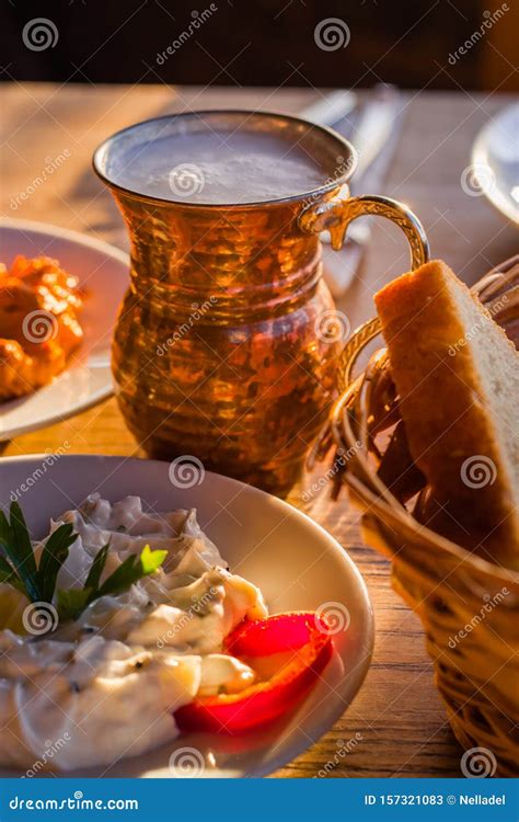 Traditional Turkish Appetizers On Table In Evening Sun Light And Ayran