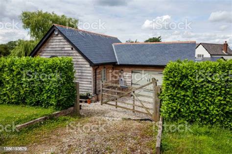 Traditional Timber Clad Garage And Driveway Stock Photo Download