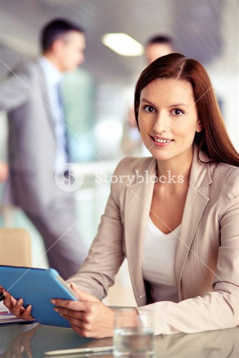 Portrait Of Confident Employee With Touchpad Looking At Camera On