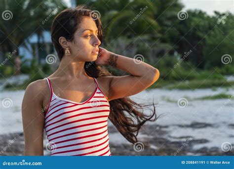A Lovely Brunette Model Enjoys The Sunset While On Vacation In The YucatÃ¡n Peninsula Near