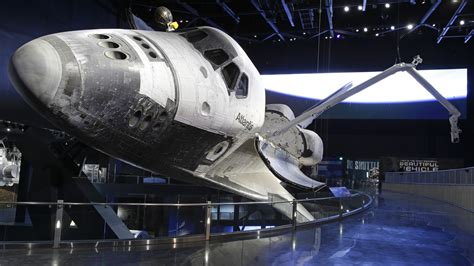 NASA; KENNEDY SPACE CENTER AND SPACE SHUTTLE ATLANTIS WELCOME YOU