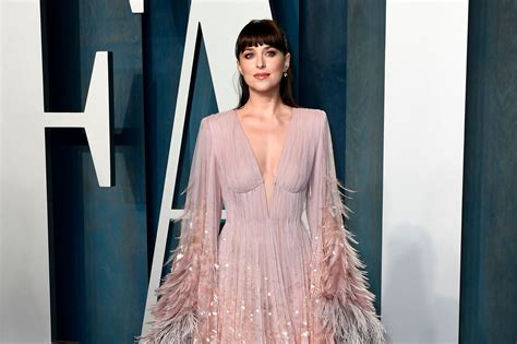 Dakota Johnson Wore A Plunging Feathered Gown At The Oscars After Party