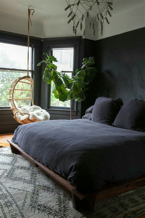 This bedroom has a clear focal point as the bed is positioned between the darker gray wall color and underneath the woven tapestry. Pin on modern design