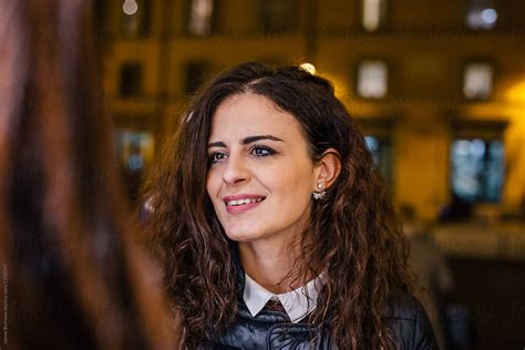 Italian Woman Listening To Friend Talking By Stocksy Contributor Jayme Burrows Stocksy