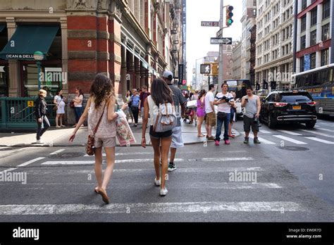 Two Young Girls Crossing Street In New York City Street Life Stock