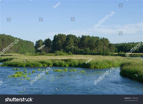 Tranquil River Flowing Through Meadows Before Stock Photo 17465434