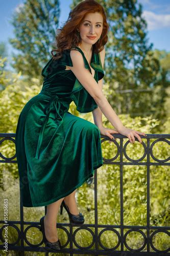 Gorgeous Redhead Woman With Pale Skin In Green Velvet Dress In Vintage
