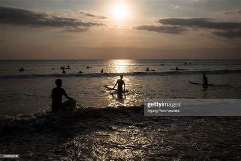 Tourists Surf At Kuta Beach On September 4 2014 In Kuta Bali News