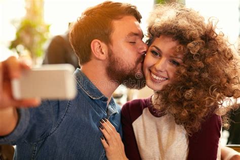 Couple Taking Selfie While Kissing Stock Photo Image Of Inside Indoor