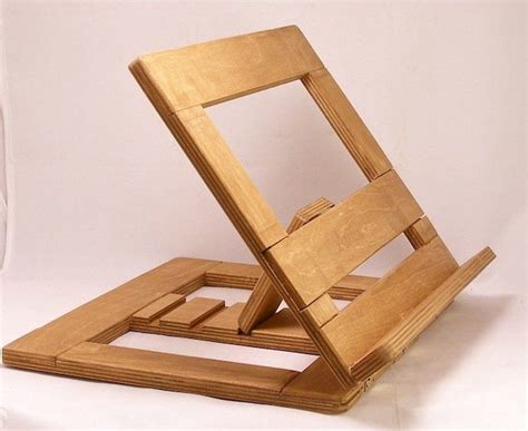 The wooden book stand design has a diagonal framework hold by a piece