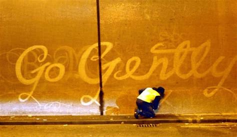 Reverse Graffiti Street Artists Paint Images On Walls By Scrubbing