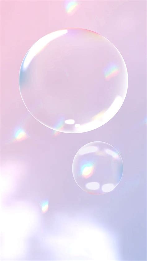 Two Soap Bubbles Floating In The Air On A Pink And Blue Sky Background